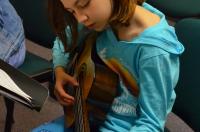 Child playing guitar