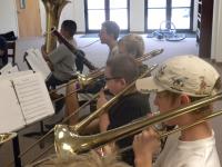 Middle school children playing trombone